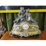 A mid 19th century French gilt metal and spelter clock with marble panels, the top depicting two