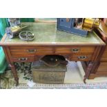 An Edwardian walnut ladies writing desk, the leather inset top above four drawers and kneehole on