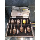 Six cake knives with silver blades and mother of pearl handles and six cased silver coffee spoons