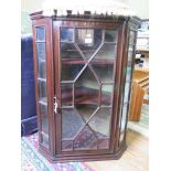 A George III style mahogany glazed corner cabinet, with astragal glazed door and sides, 70cm wide,