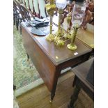 An Edwardian mahogany drop leaf table, the rectangular top on turned legs and later brass cap