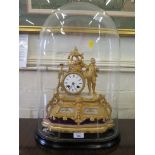 A French gilt metal and alabaster mantel clock, the case depicting a walker beckoning a bird over