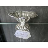 A Victorian silver sweet meat dish on single foot, decorated flowers to edge, London 1865