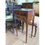 A George III mahogany and satinwood crossbanded side table, the oval inlaid top over two short and