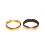 A 22 carat gold wedding ring and another gold colour wedding ring
