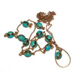 A necklace set with round turquoise and matching 15 carat gold pendant and neck chain