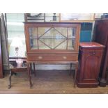 An Edwardian mahogany and satinwood crossbanded bijouterie cabinet, with bevelled glass top and fall