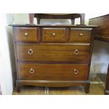 An Edwardian walnut chest with three long graduated drawers on bracket feet, 107cm wide