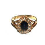 A sapphire and diamond cluster ring set in 18 carat gold