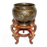 A large late 19th century Chinese bronze bowl decorated with elephants, 27cm high together with a