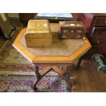 An Edwardian walnut octagonal centre table, with leather inset top on fluted turned supports with