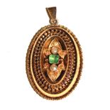 A Victorian gold colour metal locket back pendant set with an emerald and two pearls