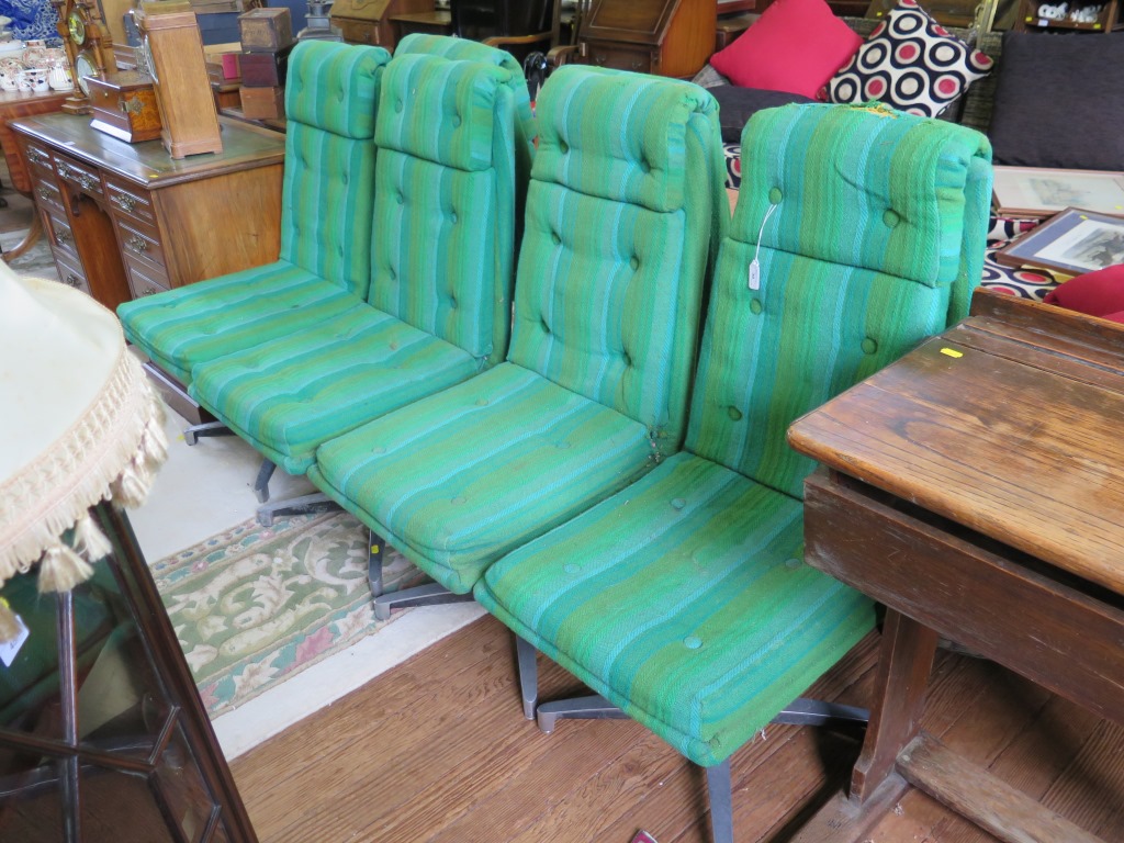 A set of six 1970s dining chairs, with green button upholstered backs and seats on aluminium bases