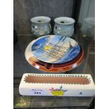 A pair of Poole pottery candle holders, ashtray, rectangular posy holder and pictorial plate of