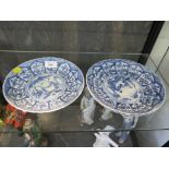 A set of three Chinese blue and white dishes, depicting figures in a garden, in arched floral