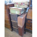 A red leather overnight suitcase stamped Mappin & Webb, with embossed initials and canvas cover,