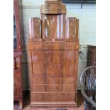 A 19th century Biedermeier flame mahogany secretaire a abattant, the superstructure with three