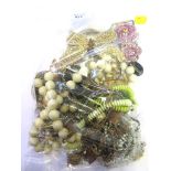 A large bag of costume jewellery to include two large pieces of Butler and Wilson