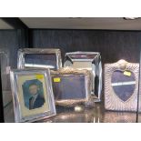 Four large silver photo frames and a silver plated frame