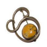 A silver brooch set with agate stone