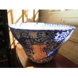 A large blue and white jardiniere, with all over decoration of flowers and exotic birds, repaired,