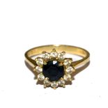 A small diamond and sapphire cluster ring set in 18 carat gold