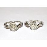 A pair of cross over rings set with round and baguette diamonds marked 925 silver