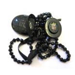 A jet locket, together with a bakelite locket on French jet bead necklace