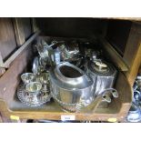 A collection of silver plate to include two tea sets, eggs cups and tray