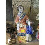 A Chinese ceramic figure of a seated mother teaching a boy calligraphy, with a fitted case, 22cm