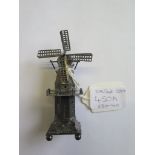 A miniature silver windmill