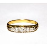 A five stone diamond ring set in 18 carat gold