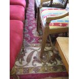 An Indian wool carpet, the red ground with all over foliate and floral design within an ivory