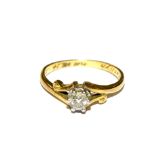 A single stone diamond ring set in 18 carat gold and platinum