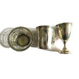 A miniature silver basket, a miniature trophy cup, a silver three handled mug