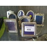 Eight small silver photo frames