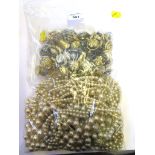 A large bag of costume pearls, together with a miscellaneous bag of costume jewellery, two in lot