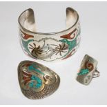 A trio of white metal bangle pendant and ring, all inlaid (possibly Egyptian)