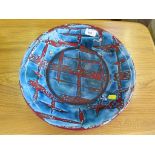 A Poole Pottery dish, with abstract blue and red lattice pattern, 35cm diameter