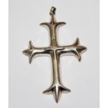 A large silver cross pendant