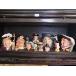 Seven Royal Doulton character jugs, including John Doulton, Henry VIII, Rip Van Winkle, a Beswick