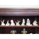 Two Lladro figures of Eskimo children with polar bear cubs, three Lladro bird figures and two others