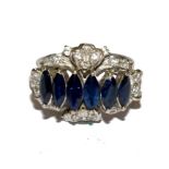 A diamond and six stone marquise blue stone (possibly sapphires) ring set in white metal