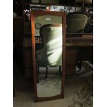 A pair of Nathan teak bedside cabinets and a wall mirror