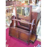An Edwardian mahogany wall shelf with double doors and shaped sides, 59cm wide and a dressing