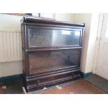 A Globe Wernicke type stacking bookcase with two graduated tiers, and base drawer, 86cm wide, 89cm