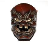 A signed wooden Japanese oni devil, 5cm high