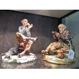 A Capodimonte figure of a man darning a sock, stamped Tyche 'Tosca' 24cm high and another of a tramp