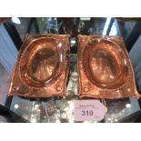 A pair of Arts and Crafts copper Duchess of Sutherland's Cripples Guild rectangular pin trays,