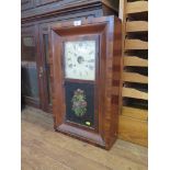 An oak cased mantel clock, retailed by Edward & Sons of London and Glasgow, with silvered dial and